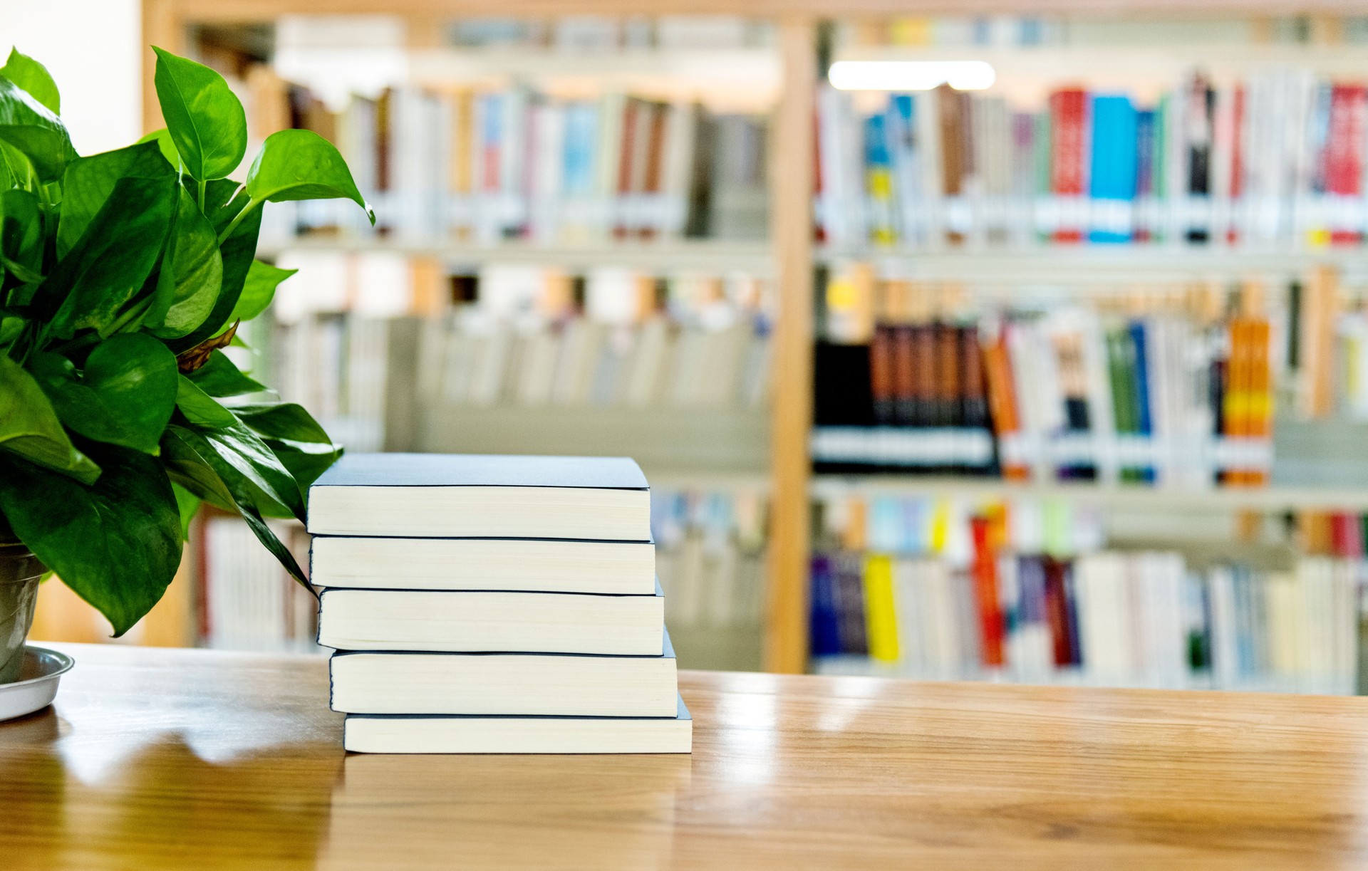 Stack of  books on the table of public library